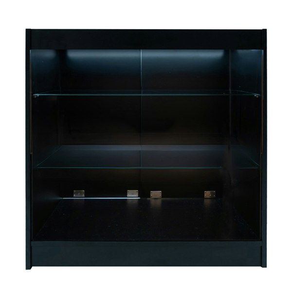 Black LED retail shop counter K900 featuring a sleek design, glass shelves, and interior lighting for enhanced product display