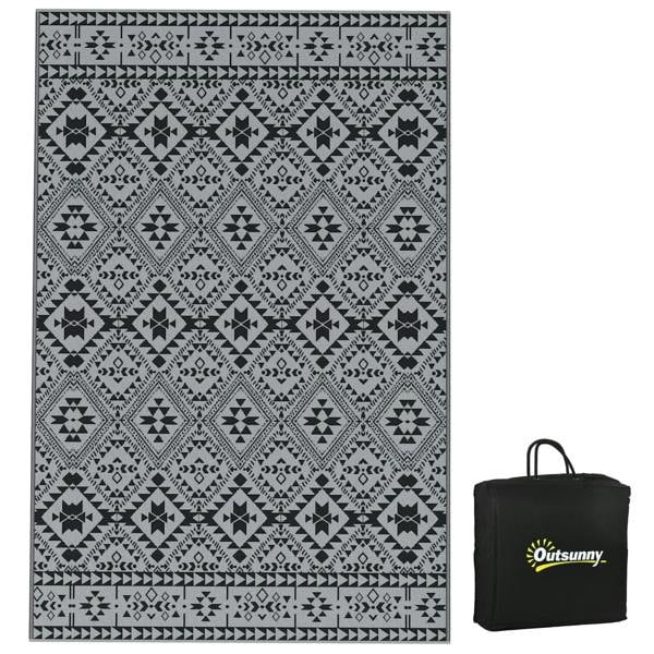 Black and grey geometric outdoor rug with matching black carry bag