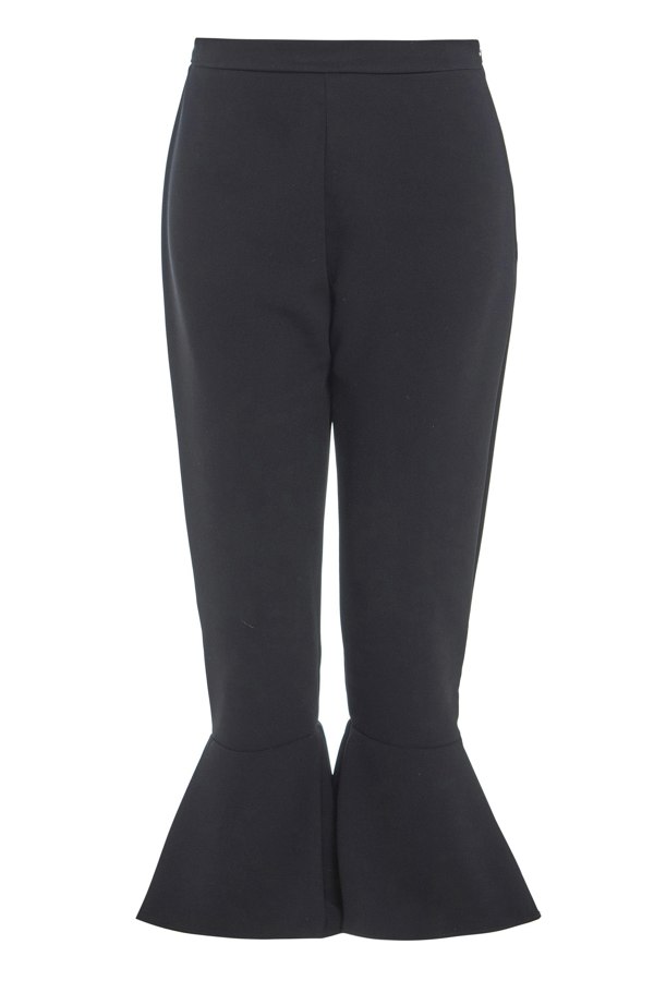 A woman's Sarvin black frill hem trousers.