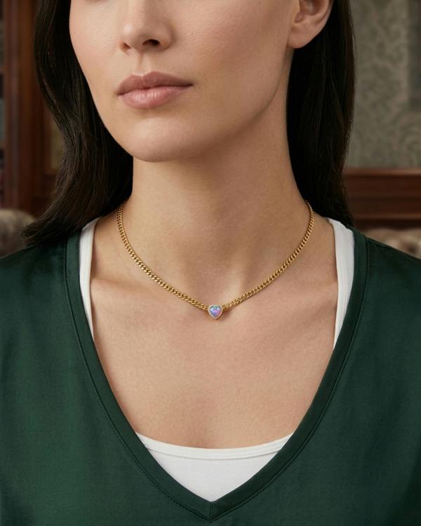 Model wearing waterproof 14k gold jewelry in water, demonstrating non-tarnish 316L steel durability. Pink Opal