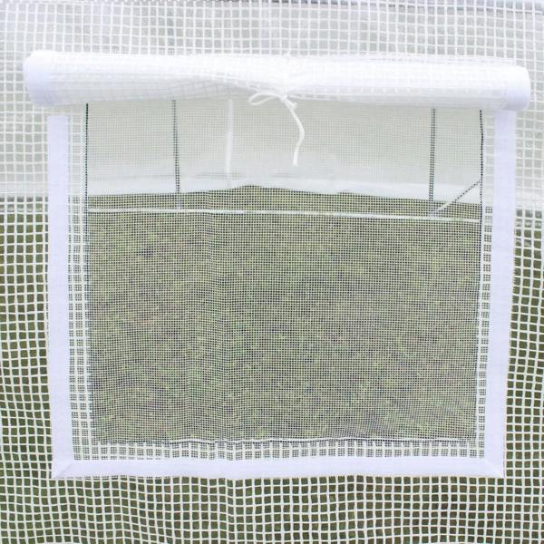 White greenhouse cover mesh close-up with tied roll-up window section