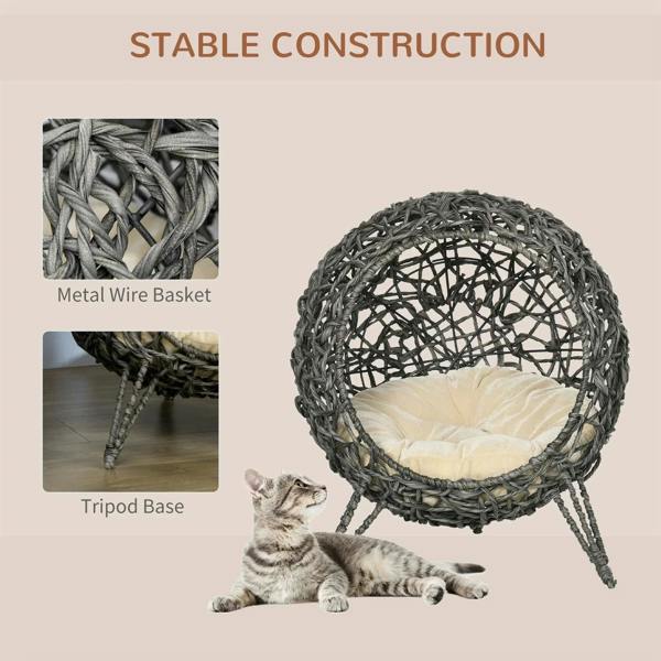 Grey rattan cat bed house basket with cream cushion and three-legged tripod base