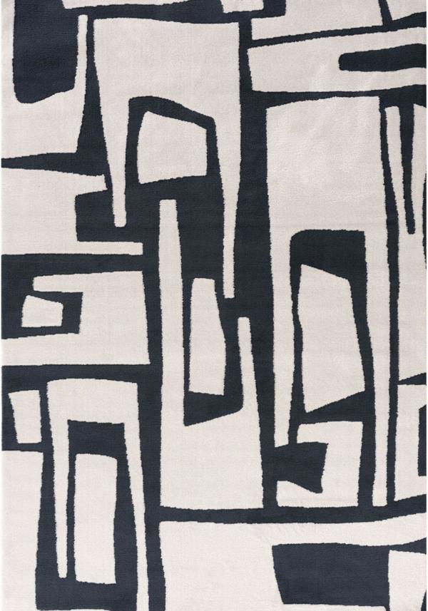 Abstract pattern of black and white geometric shapes on a textured fabric background