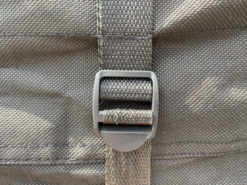 A closeup image of the strap on the OLPRO Breathable Waterproof 4Ply Caravan Cover.