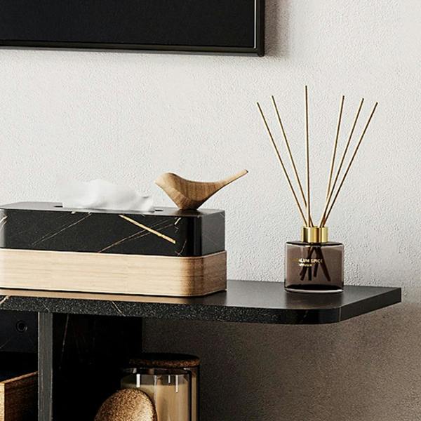 Black floating media console with open lower cubby and top shelf for decor