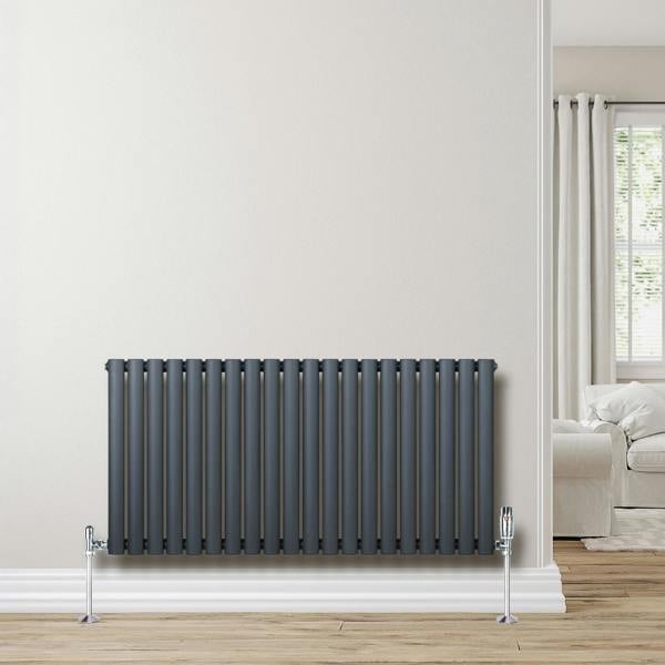 Anthracite grey oval single column radiator, 600 x 1200mm, featuring sleek vertical lines and a modern design, installed against a light wall