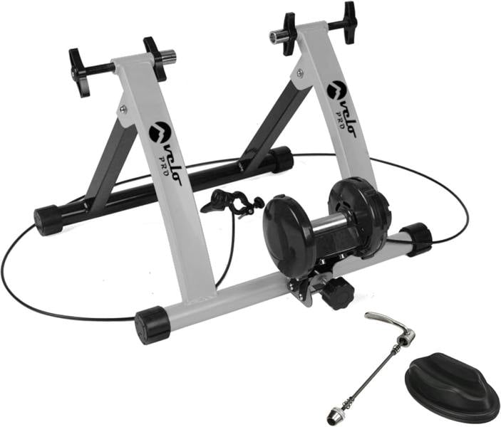 Velo Pro Silver Magnetic Turbo Trainer features a sturdy silver and black frame, adjustable resistance, and includes a quick-release skewer and rubber feet for stability