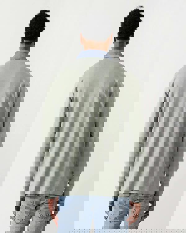 back view of a model wearing a GANT Mens Regular Chambray Heavy Rugger in 10 Ceramic Grey