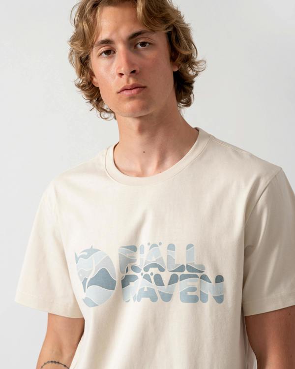 close up shot of a model wearing a Fjallraven Multicolor Logo Mens T-Shirt in Chalk White 113