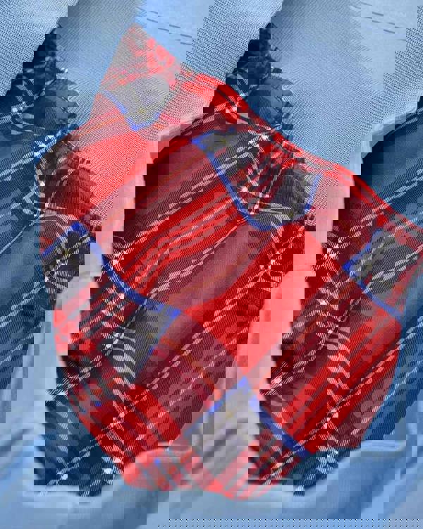 Lambretta Mens ShowerProof Classic Harrington MOD Scooter Jacket Coat, close-up of blue outer fabric with tartan interior lining in red, black, white, pink, and blue plaid pattern.