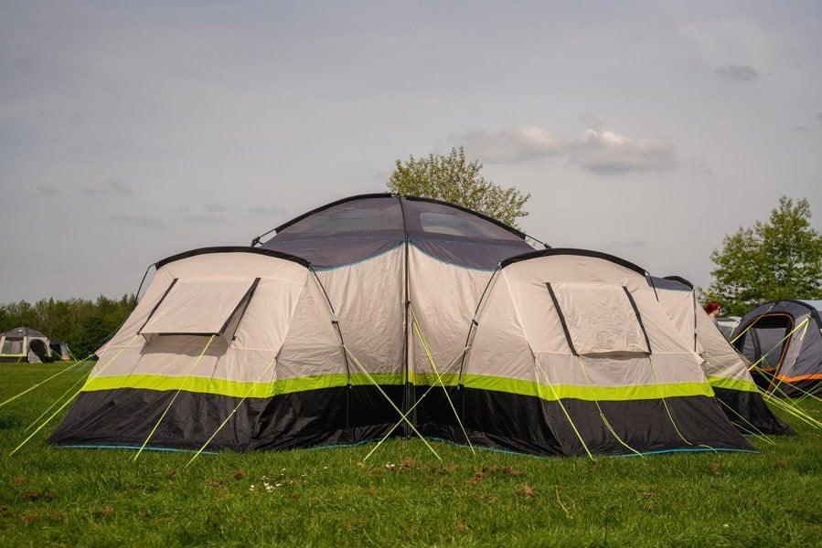 The Hive 6 Berth Poled Tent by OLPRO pitched in a campsite.