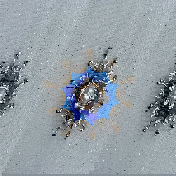 Blue pearl brooch, gold tone starburst design, central white faux pearl, deep blue enamel detailing, surrounded by clear crystal accents, vintage inspired jewellery, elegant statement accessory, unique gift for her
