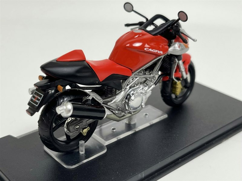 a red and black motorcycle on a stand