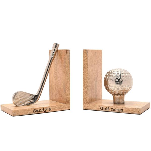 A pair of custom engraved wooden football bookends against a clean white background, showing the words 'Tanner's' and 'Books' beneath a metallic boot and ball.