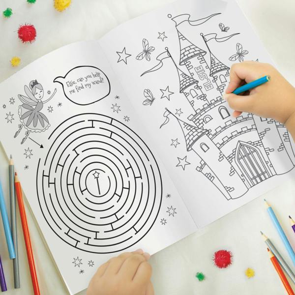 Open view of the personalised colouring book featuring a circular wand maze activity addressed to Elsie and a fairy tale castle illustration with ELSIE engraved on the tower
