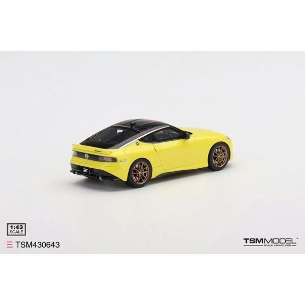 a yellow toy car on a white background