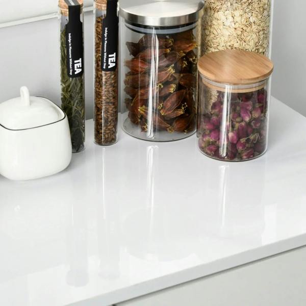 Glossy white sideboard top surface with jars and canisters for storage