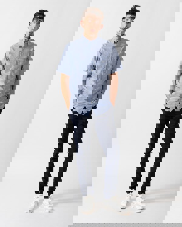 Full Length shot of a Model wearing a GANT Mens Regular Fit Short Sleeve Oxford Shirt in College Blue