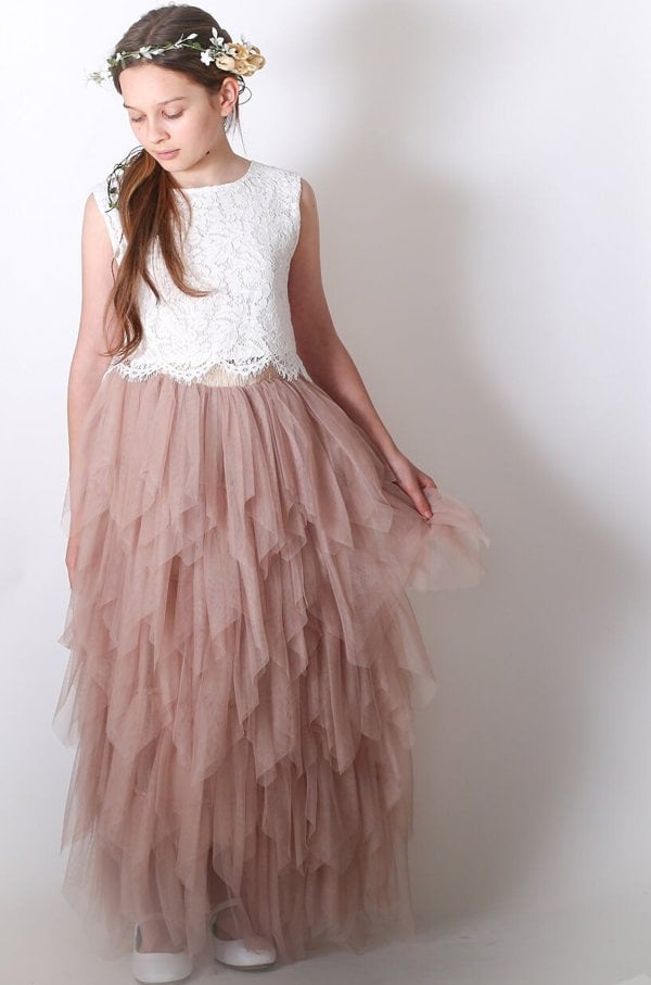 Young girl holding skirt