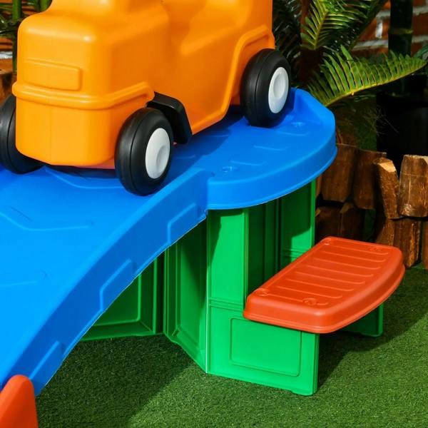 Orange ride-on car on blue ramp with green platform and orange side step