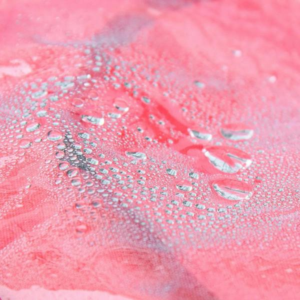 Water droplets on the red clear rain cover panel, showing splash-proof texture