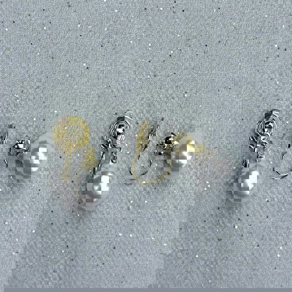 Pearl drop clip-on earrings, gold tone setting, round white faux pearls, secure hinged clip fastening, classic timeless design, vintage inspired jewellery, elegant non-pierced earrings, sophisticated accessory or gift for her
