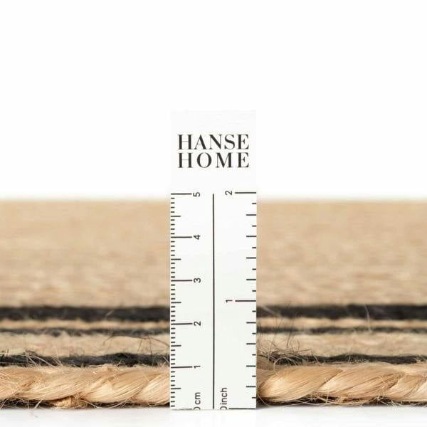 Close-up of woven material with a ruler and 'Hanse Home' branding.