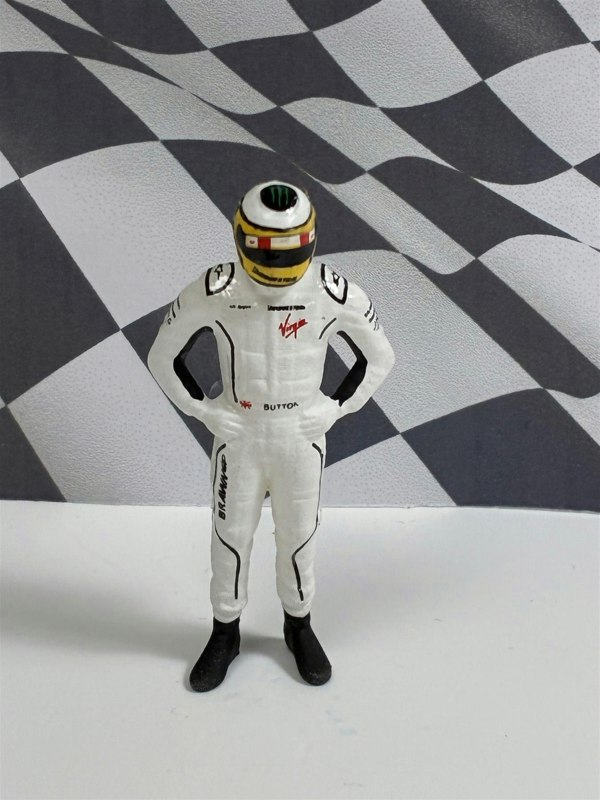 a toy figure in a race car suit