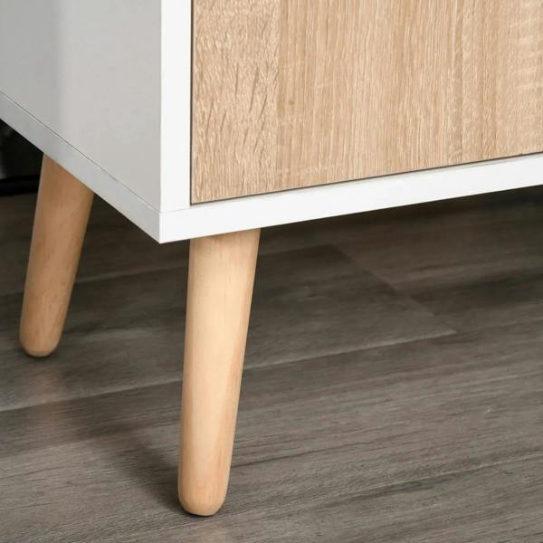Light wood tapered legs beneath a natural wood and white cabinet sideboard