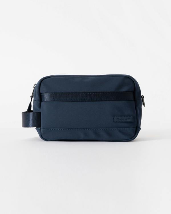 Navy blue bag with a visible brand label on a white background