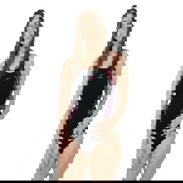 Speedo Boomstar Splice Flyback black one-piece swimsuit with purple leopard accents