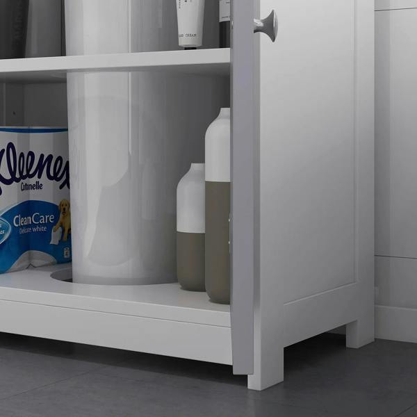 Under-sink cabinet with open interior shelf holding bottles, grey panel and white frame