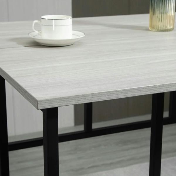 Grey tabletop with textured finish and black metal leg support, close-up