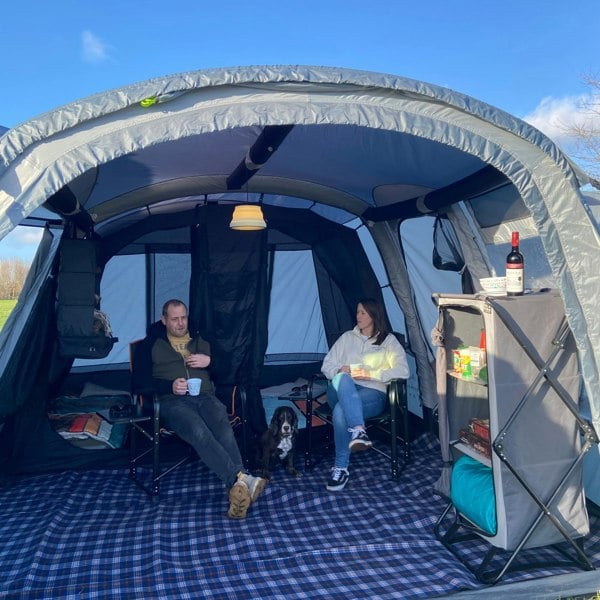 Image of OLPRO Silicone Camping Lantern, dimmable 240V, in use inside the canopy of a large family tent/awning.