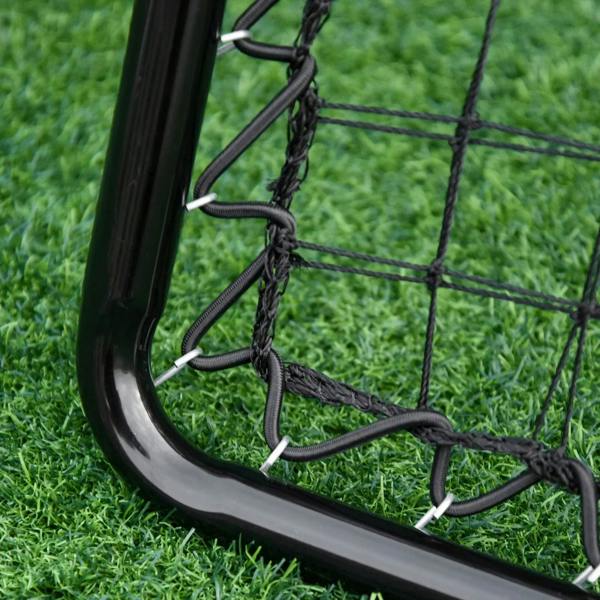 Black metal rebounder frame corner with coiled net attachment on grass
