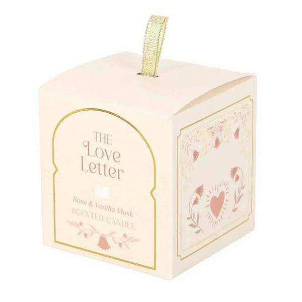 White gift box with gold ribbon and illustrated front panel