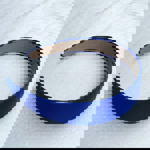Royal blue hairband, smooth satin finish, bold deep blue shade, padded structure, sleek minimalist design, versatile fashion accessory
