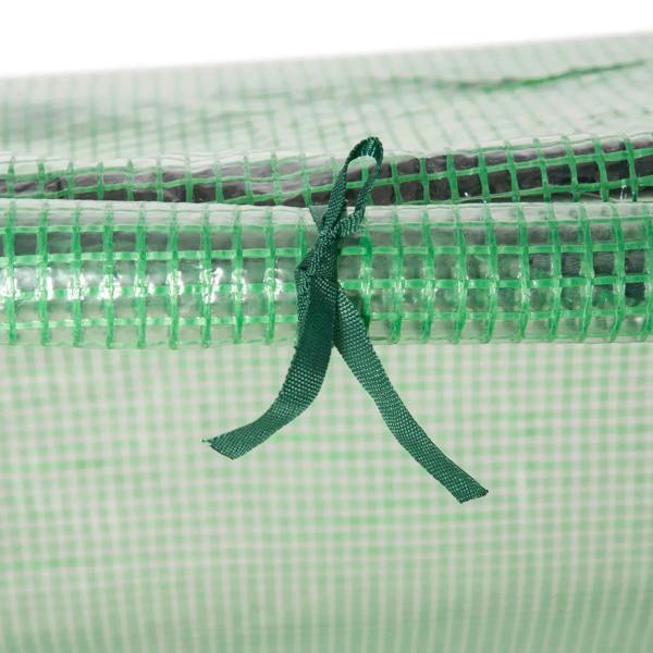 Close-up of green PE cover tie strap and zipper seam on mini greenhouse