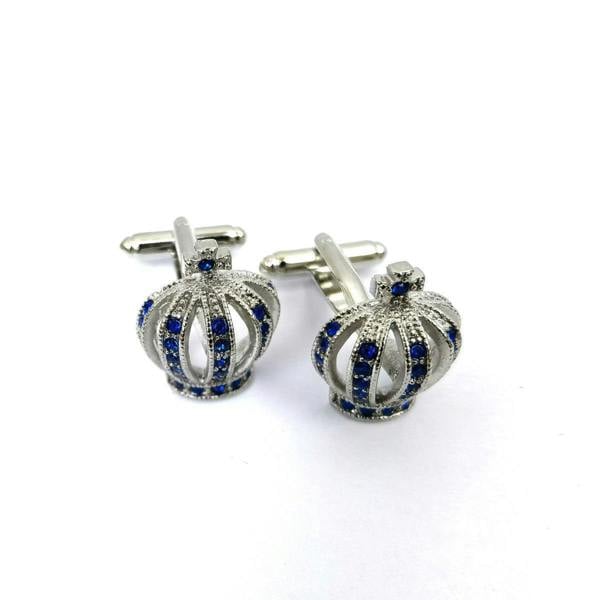 Silver crown cufflinks by PAMONI with blue gem stones, featuring intricate crown design and polished silver finish.