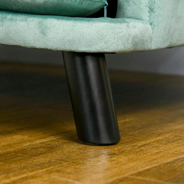 Green dog sofa bed with black tapered legs and plush upholstered seat