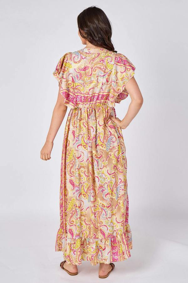 Woman wearing a colorful patterned dress on a white background