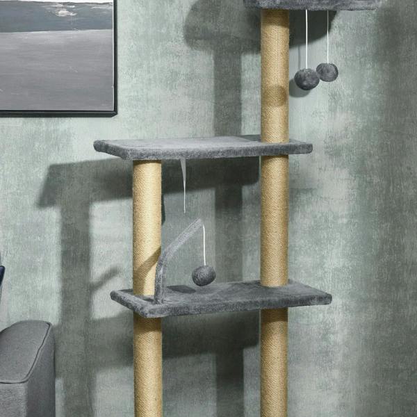 Grey floor-to-ceiling cat tree tower close-up of mid platforms, posts, and ball toys