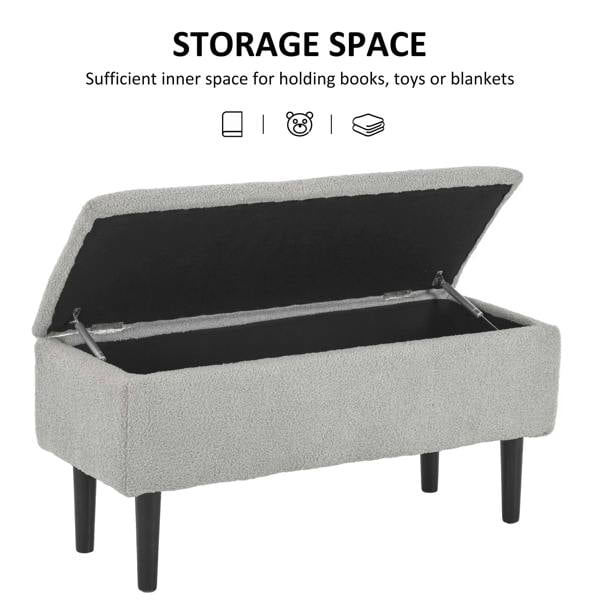 Grey fabric storage ottoman with hinged lid open, showing dark interior