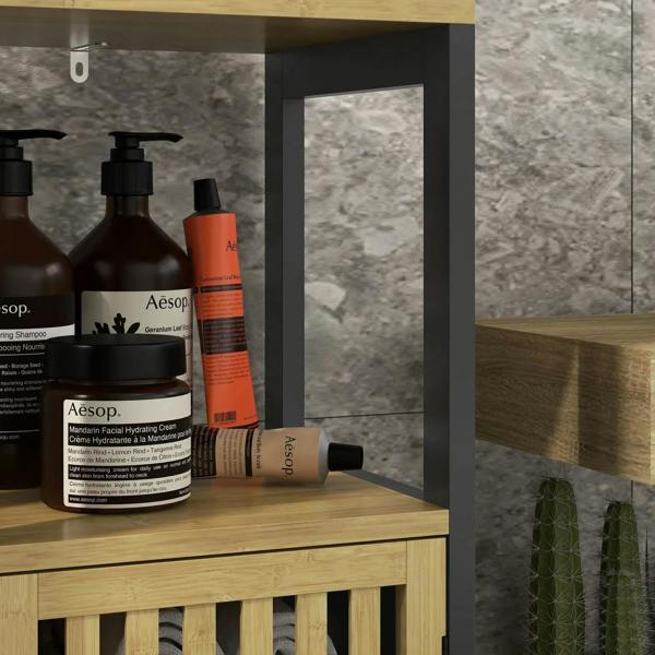 Black bathroom cabinet interior shelf with bamboo top and bathroom bottles