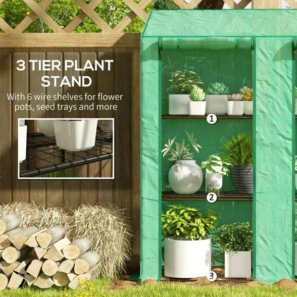 Green 3-tier plant greenhouse stand with wire shelves and potted plants inside