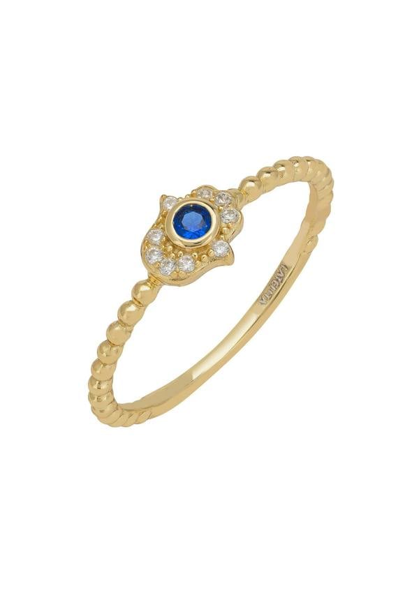 Gold ring with a blue gemstone and clear gemstone accents on a white background