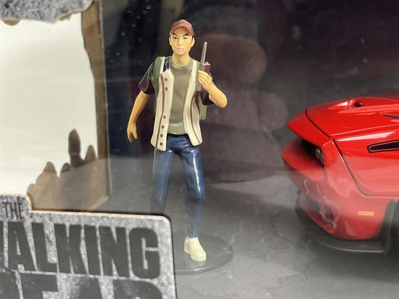 a toy figurine of a man in a case