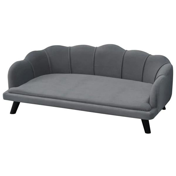 Grey upholstered dog sofa with tufted back, padded seat, and four low legs