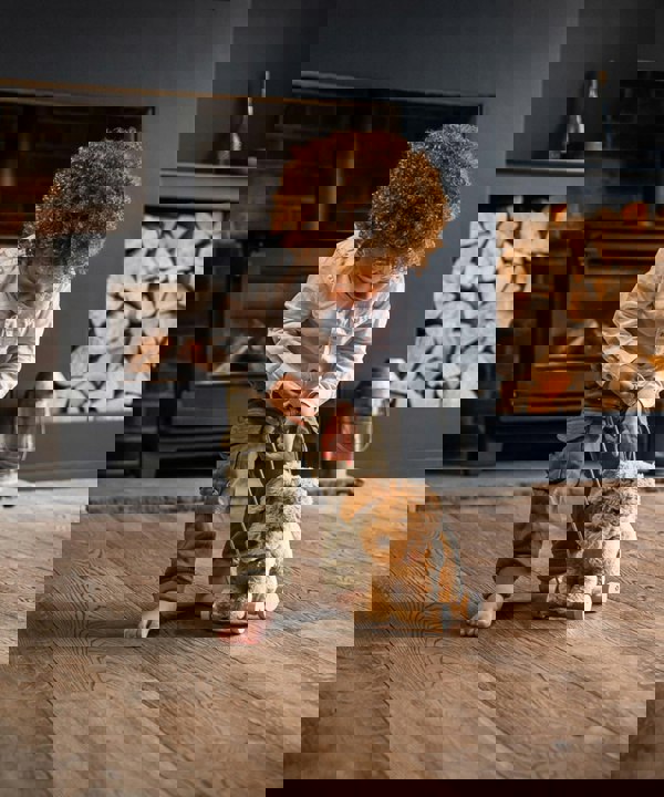 Little boy pulling dexter walking dog toy