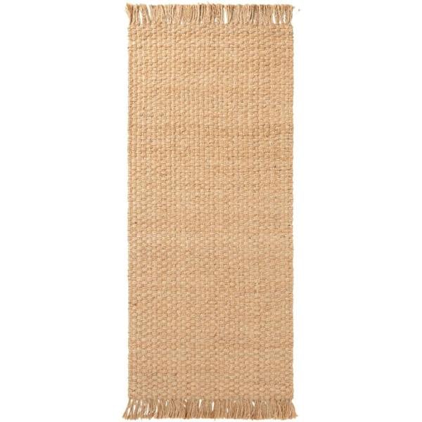 Beige woven rug with fringes on a white background